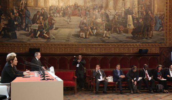 Mayoress Ada Colau (left) chairing a municipal event on housing.