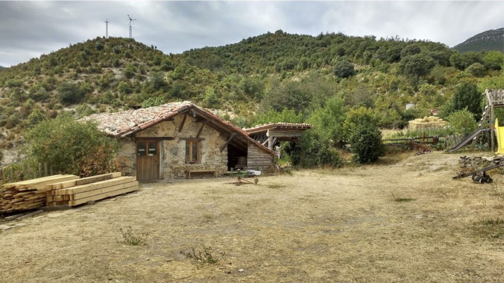 Spanish eco-village abandoned medieval hamlet restoration Spain.